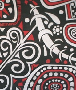 202305-Bold-Abstract-Grosh-7113 Close-up of a bold decorative pattern featuring black, white, and red geometric and swirling tribal-inspired designs.